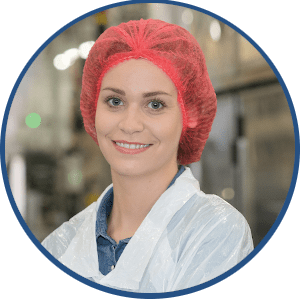 Female Line Operator with red hair net optimizing equipment effectiveness