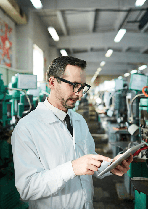 Manufacturing Factory Worker Reviewing Takt Time Formula