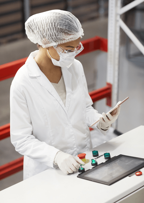 Woman reviewing OEE Calculation at Pharmaceutical Factory