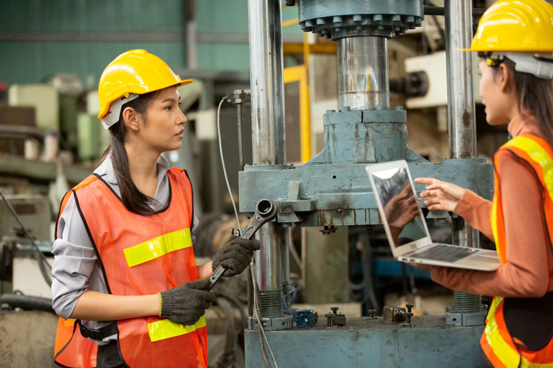 Industrial factory workers in manufacturing plant