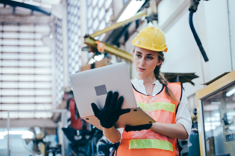 Female worker researching how to achieve a world class OEE score