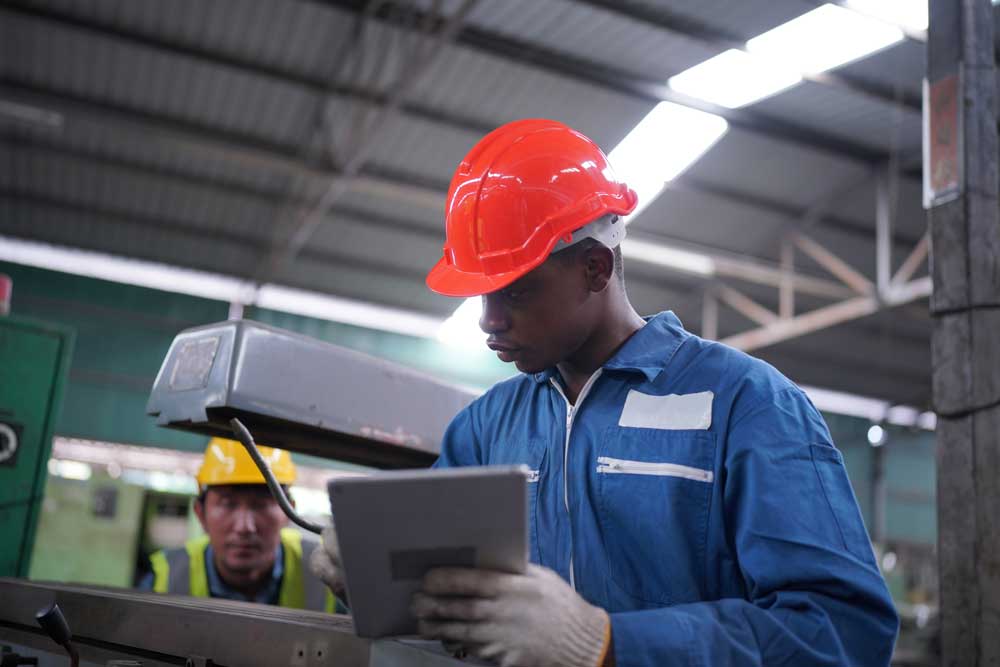 Lean manufacturing employee working in industrial factory